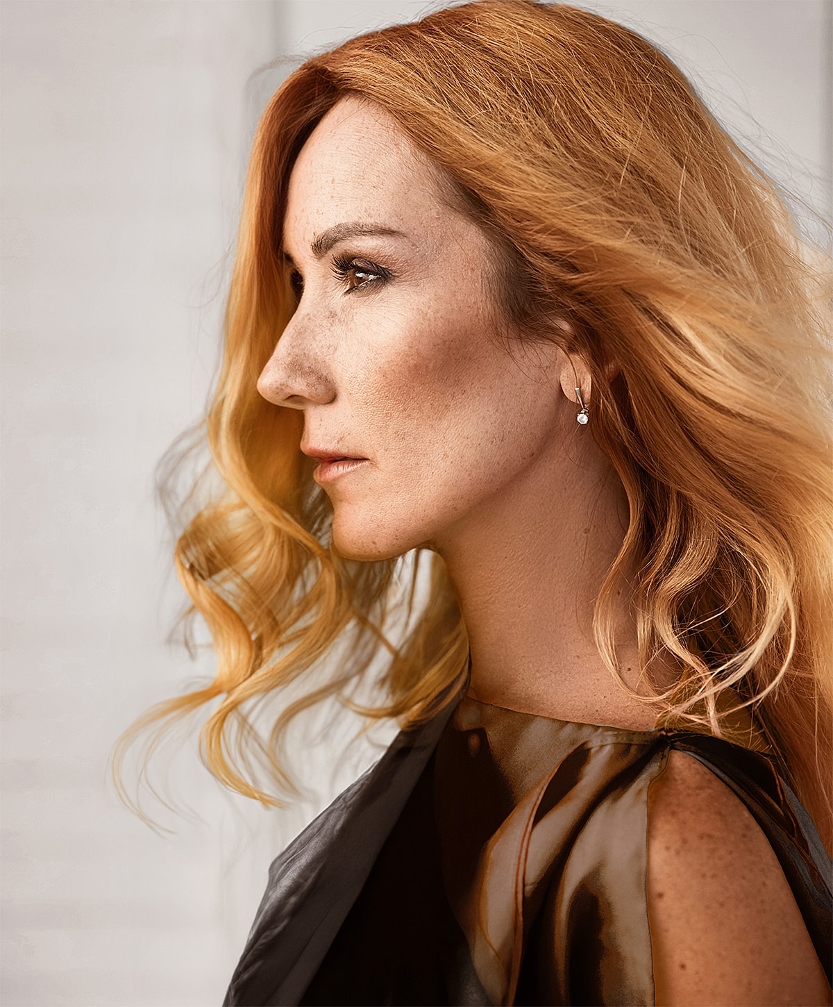 Woman walking up stairs in fitted jeans.