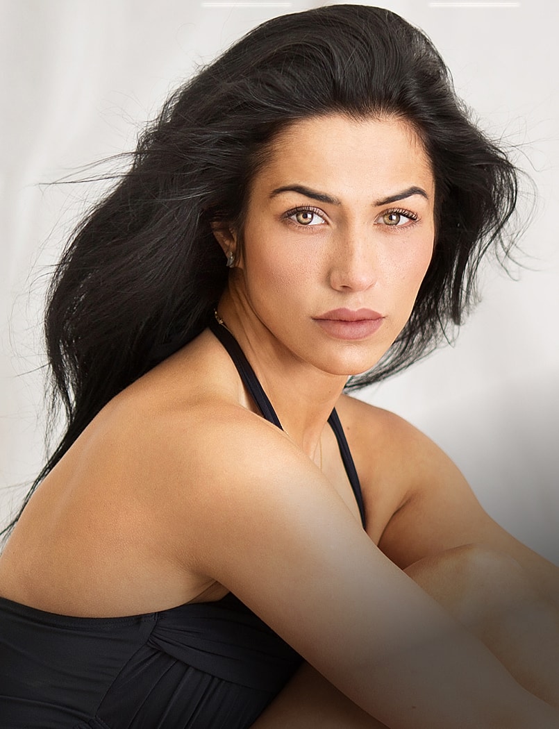 Portrait of a woman with long dark hair.