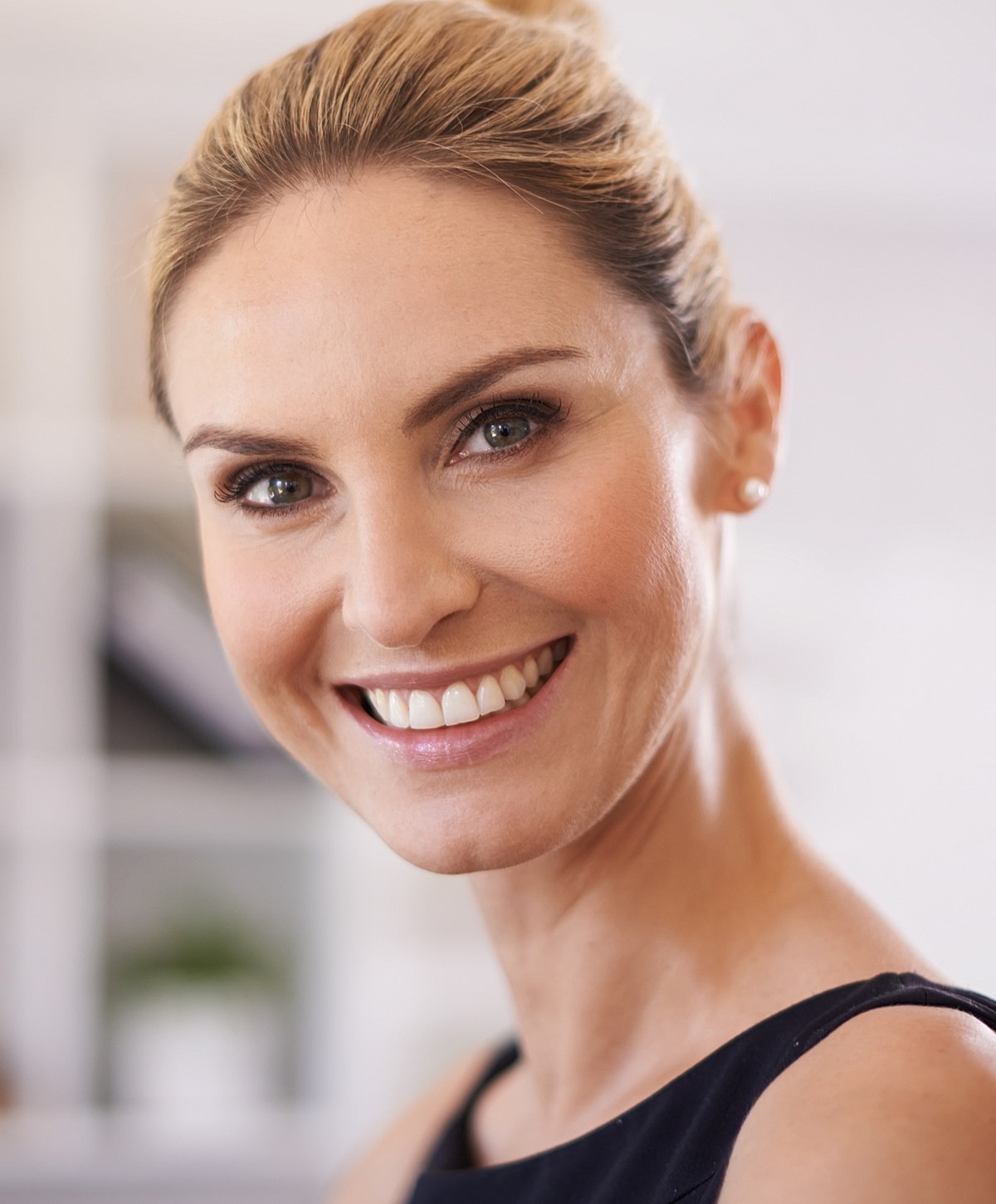 Woman in black leggings outdoors, focused on legs.