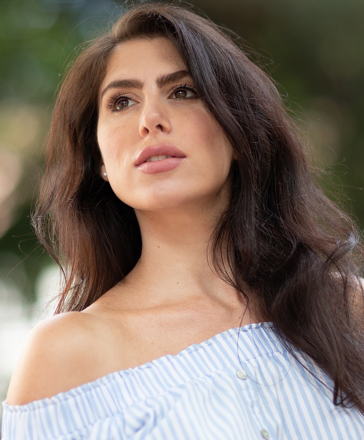 Woman walking up stairs in fitted jeans.