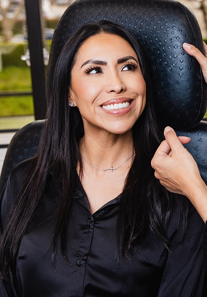 Smiling woman in a beauty treatment chair.