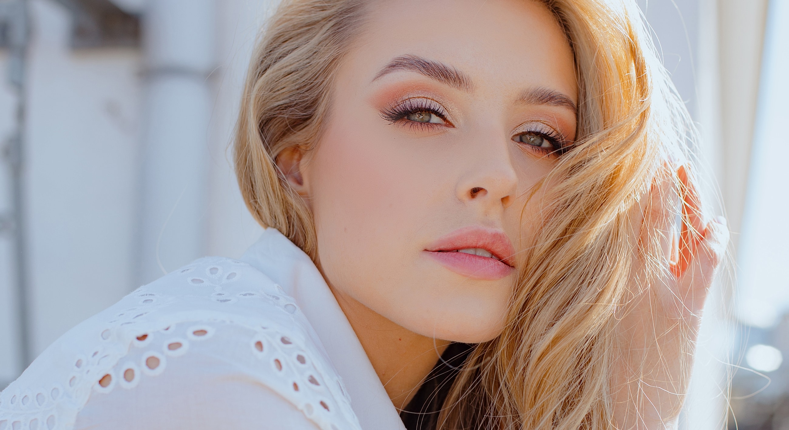 Close-up of a woman with blonde hair.