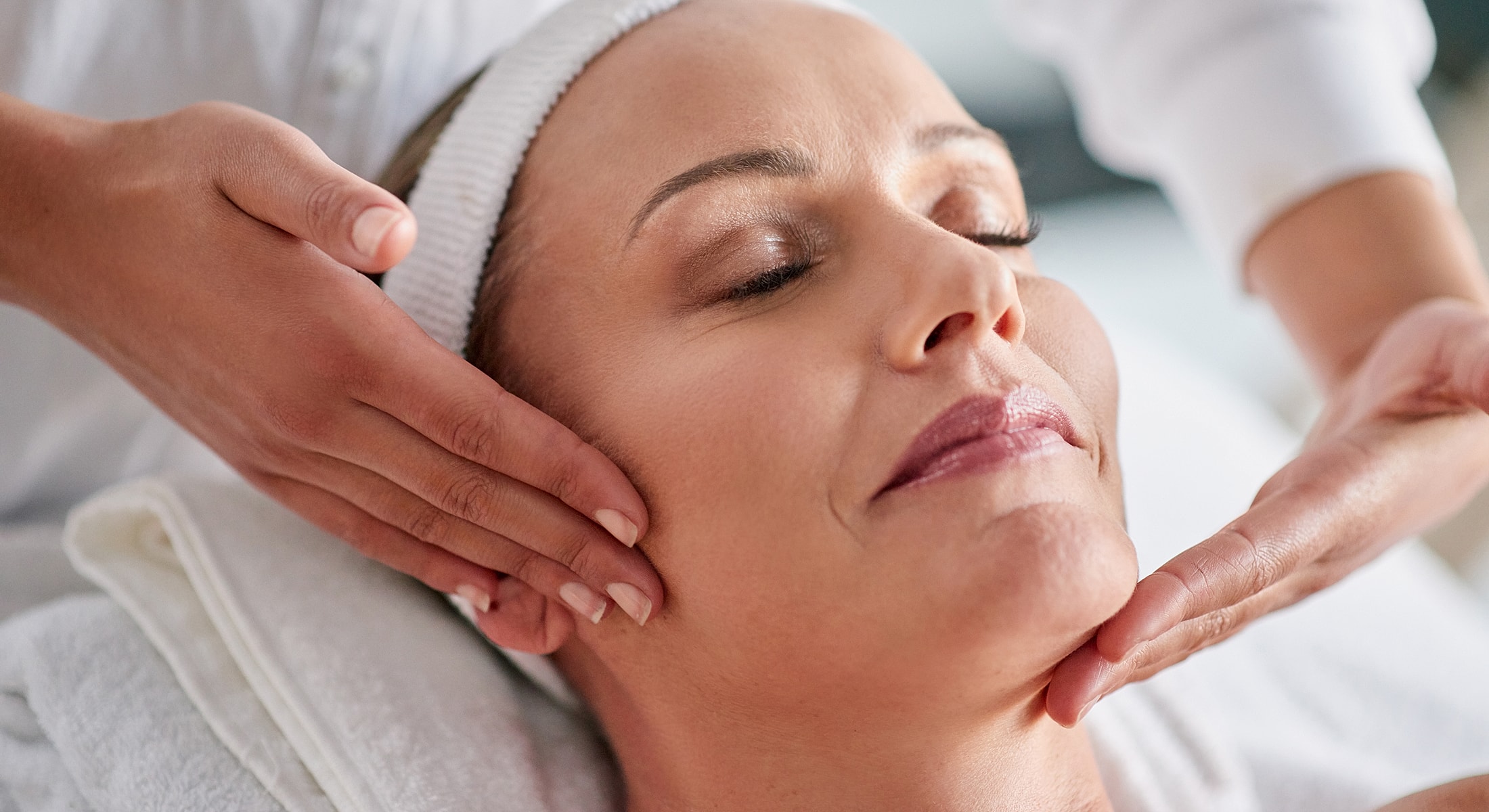 Facial treatment with gentle massage and relaxation.